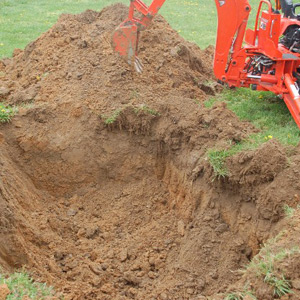 Excavator digs out a dry well or drainfield